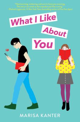 Cover of the book titled What I Like About You by Marisa Kanter. Cover is between a green and blue and depicts a teen boy walking with his phone while a teen girl looks over her book she has open in front of her face.