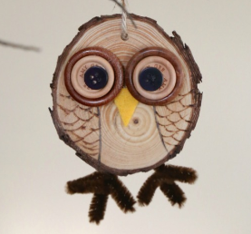 owl ornament made from a wood slice