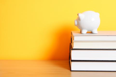 Piggy bank and books