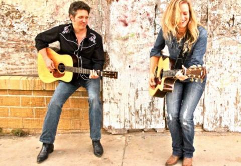 Stuart Adamson and Hilary Claire Adamson, The Flyin' A's, pictured with acoustic guitars.