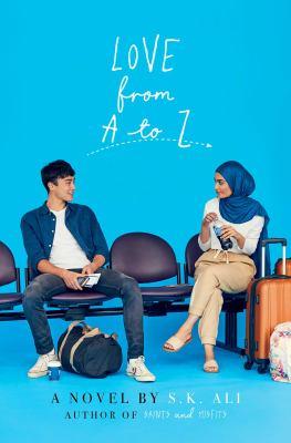 Cover of the book titled Love from A to Z by S.K. Ali. The cover is blue and shows a young man and young woman sitting on a bench with luggage. 