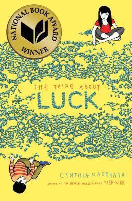Cover of the The Thing About Luck by Cynthia Kadohata. A National Book Award Winner logo is on the cover. The cover is yellow with a young Japanese girl and boy sitting. 