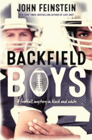 Cover of Backfield Boys by John Feinstein with two football players, one black, one white, crossing their arms