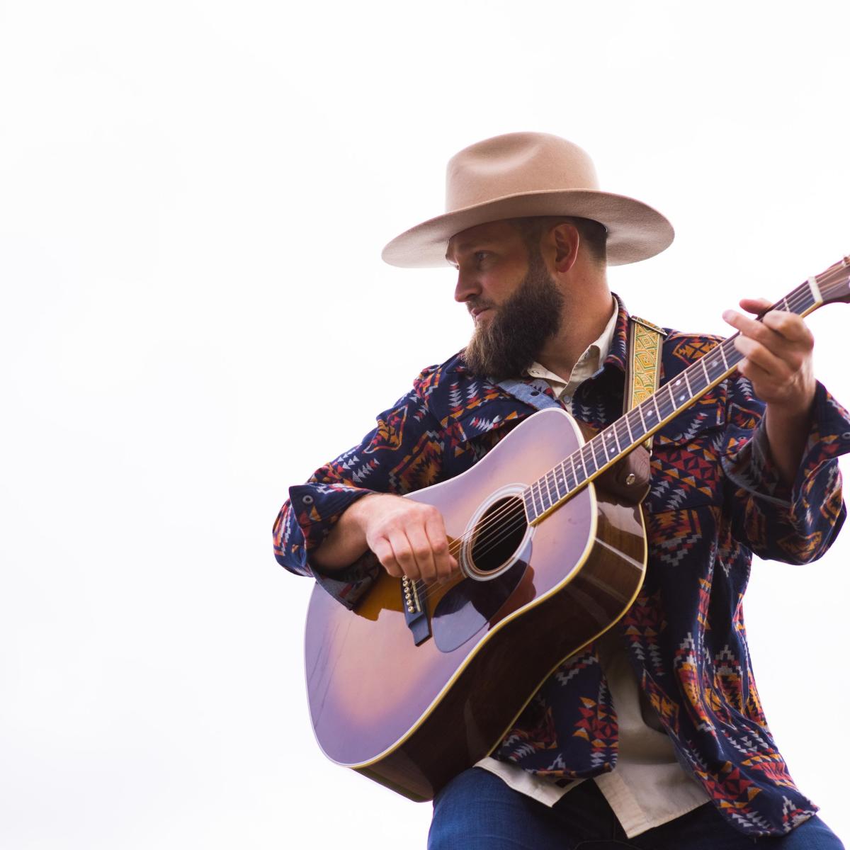 cousin curtiss with cowboy hat and guitar